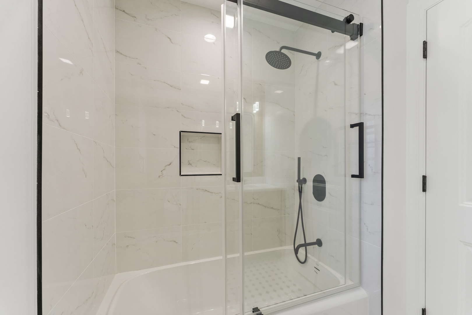 208 47th Street Western Springs, IL 60558 - Photo 18 of 53 a bathroom with a glass shower door