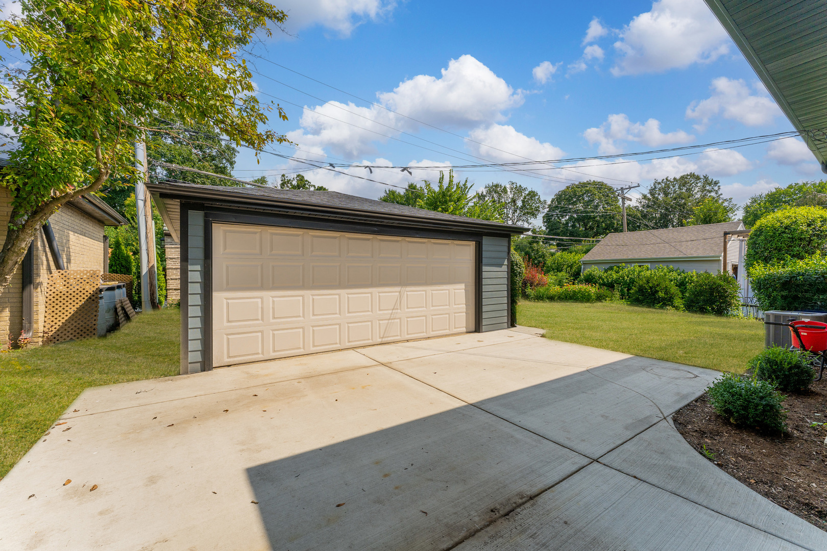 208 47th Street Western Springs, IL 60558 - Photo 37 of 53 a front view of a house with a yard and garage