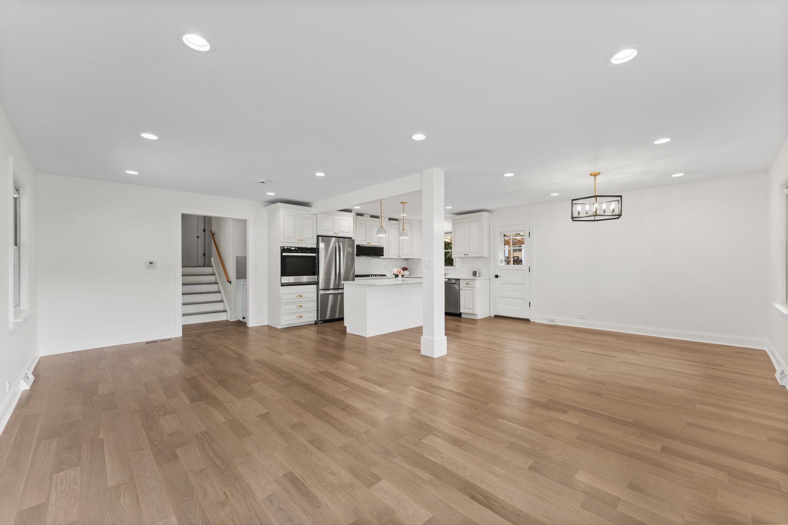 208 47th Street Western Springs, IL 60558 - Photo 7 of 53 a view of a kitchen with a refrigerator and a stove top oven