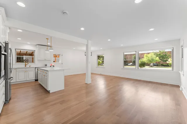 a view of kitchen with wooden floor and windows