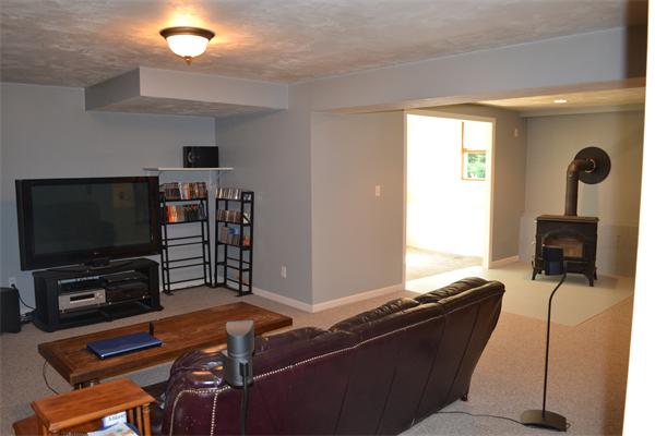 75 Irish Lane Rutland, MA 01543 - Photo 15 of 30 a living room with furniture and a flat screen tv