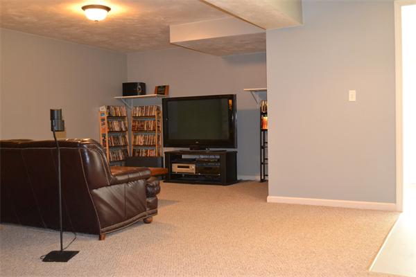 75 Irish Lane Rutland, MA 01543 - Photo 16 of 30 a living room with furniture and a flat screen tv