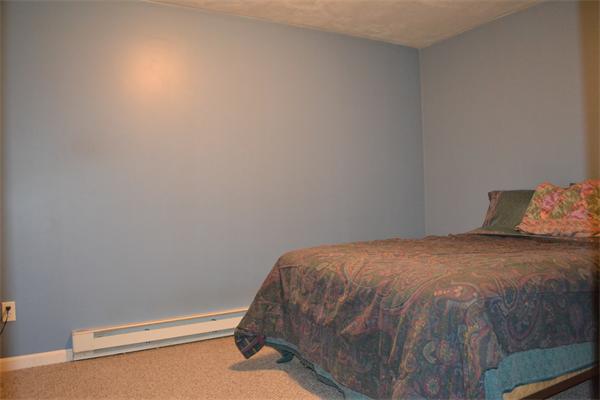 75 Irish Lane Rutland, MA 01543 - Photo 23 of 30 a bedroom with a bed and pillows
