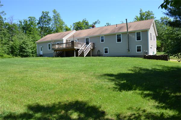 75 Irish Lane Rutland, MA 01543 - Photo 27 of 30 a aerial view of a house next to a big yard with potted plants