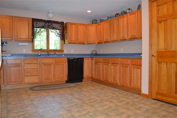75 Irish Lane Rutland, MA 01543 - Photo 5 of 30 a kitchen with stainless steel appliances granite countertop a stove a sink and a refrigerator