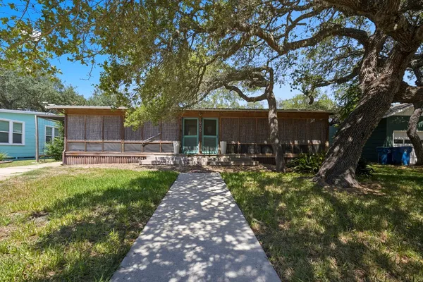 a front view of house with yard and seating area