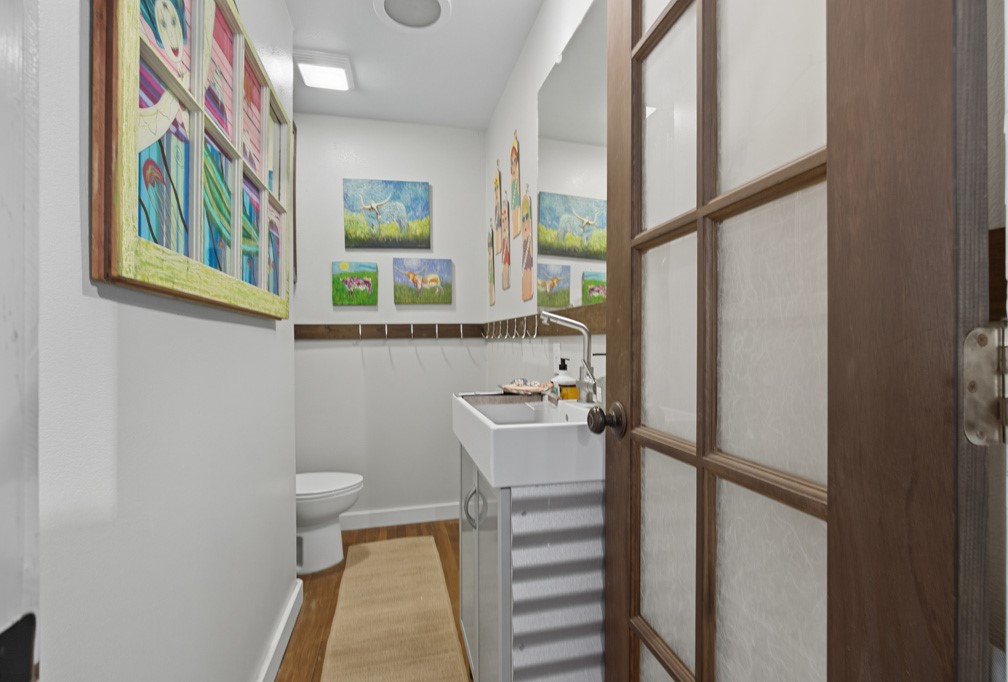 1908 Glass Avenue Rockport, TX 78382 - Photo 11 of 40 a bathroom with a sink a toilet and a window