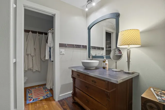 a view of a patio with a table chairs and a potted plant