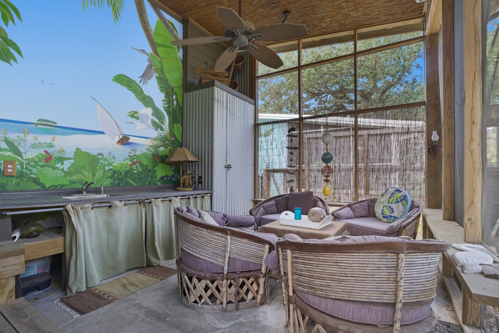 1908 Glass Avenue Rockport, TX 78382 - Photo 22 of 40 a outdoor living space with furniture and outdoor view
