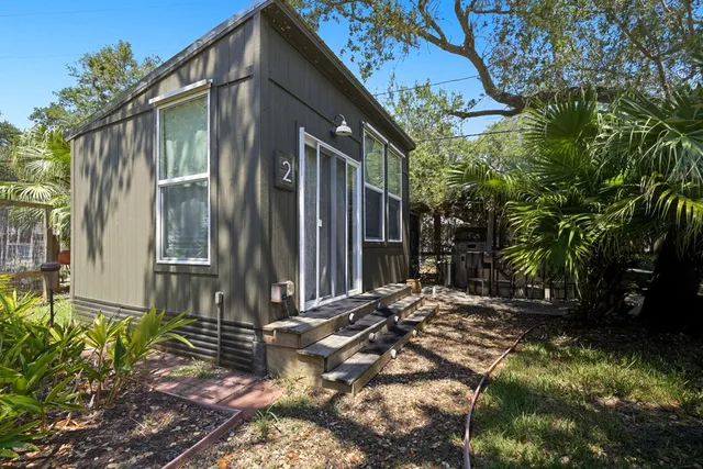 a bathroom with a sink and glass door
