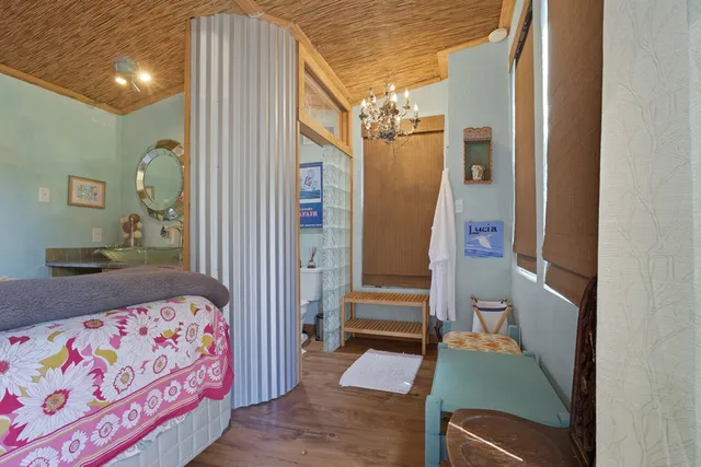 a view of house with backyard and trees