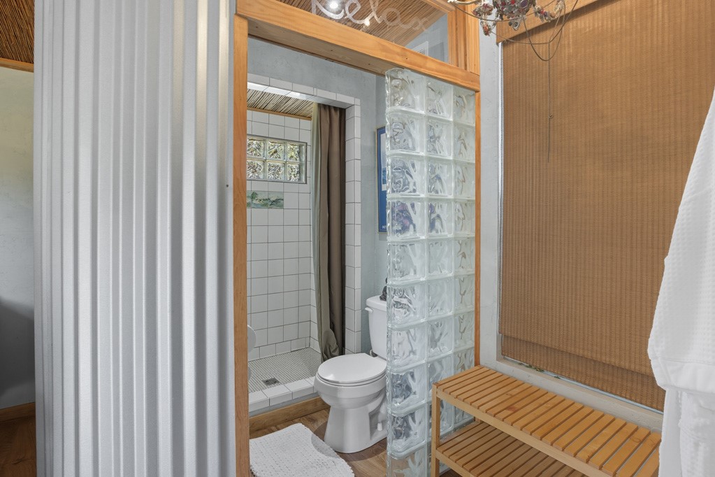 1908 Glass Avenue Rockport, TX 78382 - Photo 27 of 40 a bathroom with a toilet and a shower