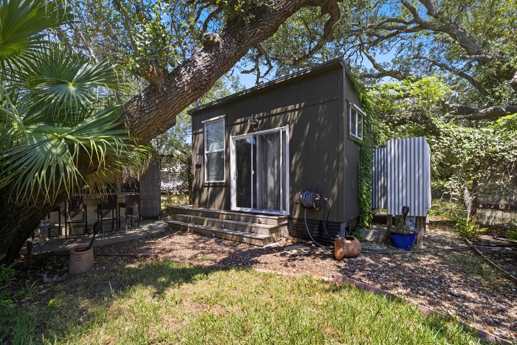 1908 Glass Avenue Rockport, TX 78382 - Photo 28 of 40 a view of house with backyard and trees