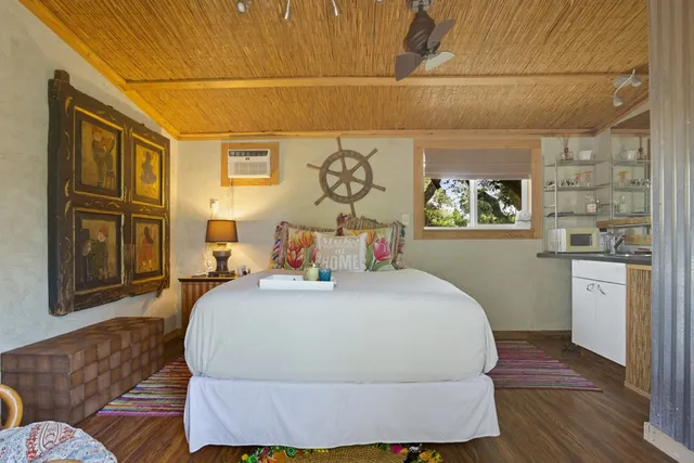 a view of a house with backyard porch and sitting area