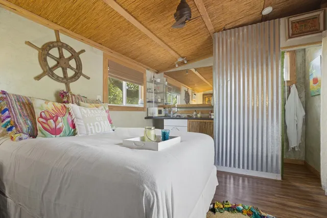 a view of a backyard with a tree