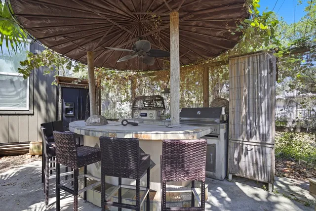 an aerial view of house with a yard and swimming pool