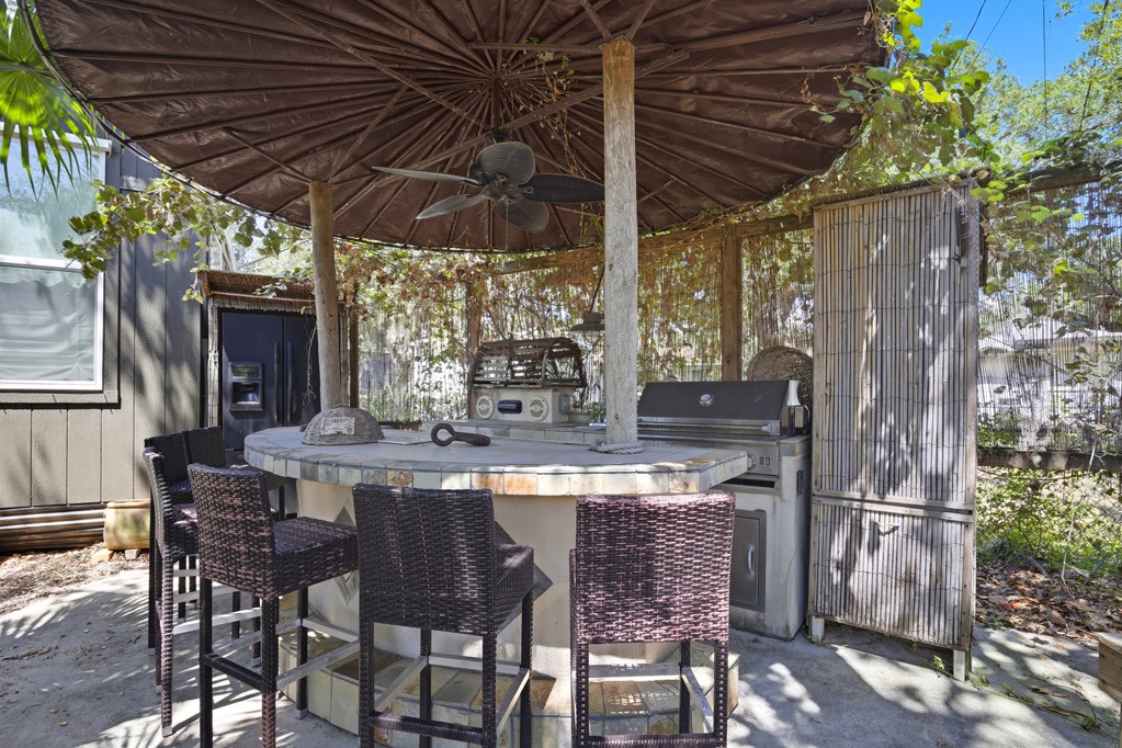 1908 Glass Avenue Rockport, TX 78382 - Photo 35 of 40 a view of an outdoor dining space with a table and chairs