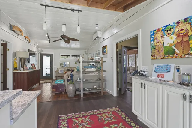 a very nice looking room with a rug and a table