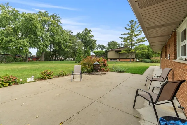 a view of a table and chairs in the patio
