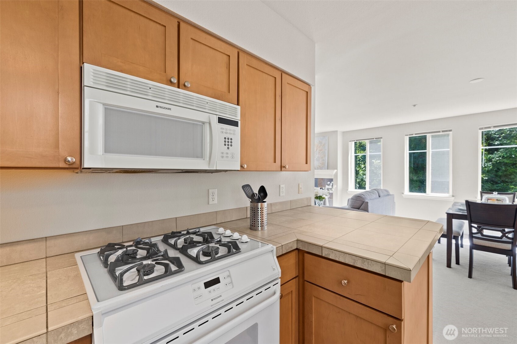 17432 Bothell Way Northeast, Unit B302 Bothell, WA 98011 - Photo 12 of 38 a kitchen with a sink cabinets and appliances