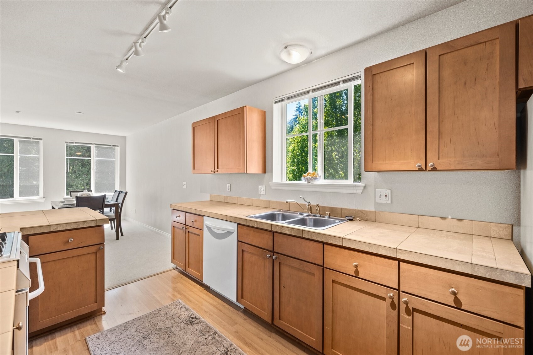 17432 Bothell Way Northeast, Unit B302 Bothell, WA 98011 - Photo 14 of 38 a kitchen that has a sink and a stove in it