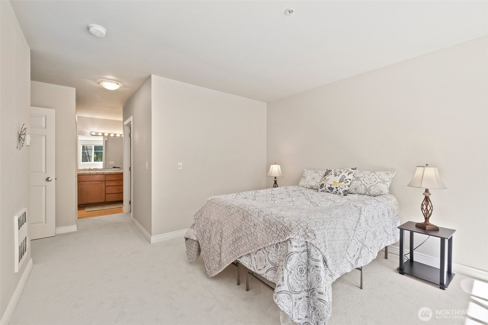 17432 Bothell Way Northeast, Unit B302 Bothell, WA 98011 - Photo 18 of 38 a bedroom with a bed and a table