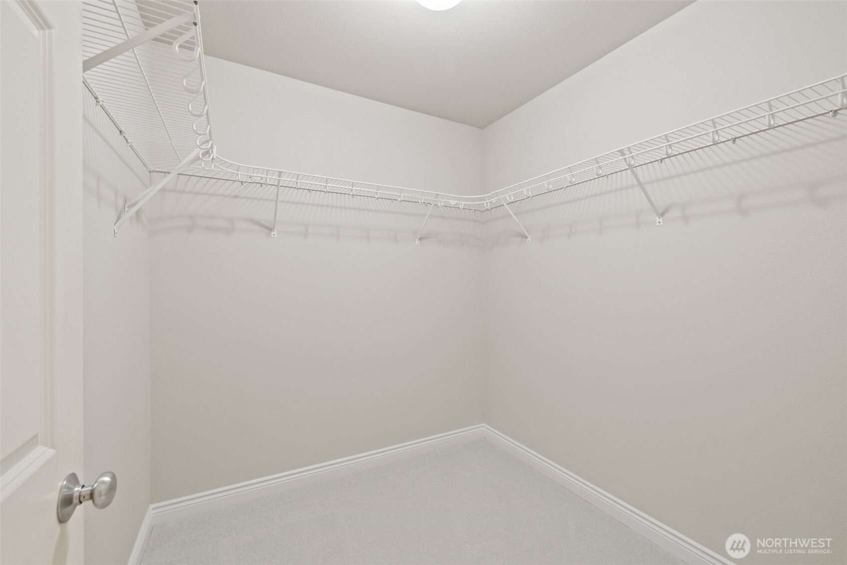 17432 Bothell Way Northeast, Unit B302 Bothell, WA 98011 - Photo 19 of 38 a view of a room with racks on the wall