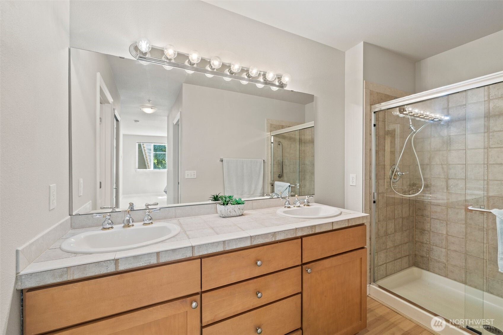 17432 Bothell Way Northeast, Unit B302 Bothell, WA 98011 - Photo 20 of 38 a bathroom with a sink double vanity and shower