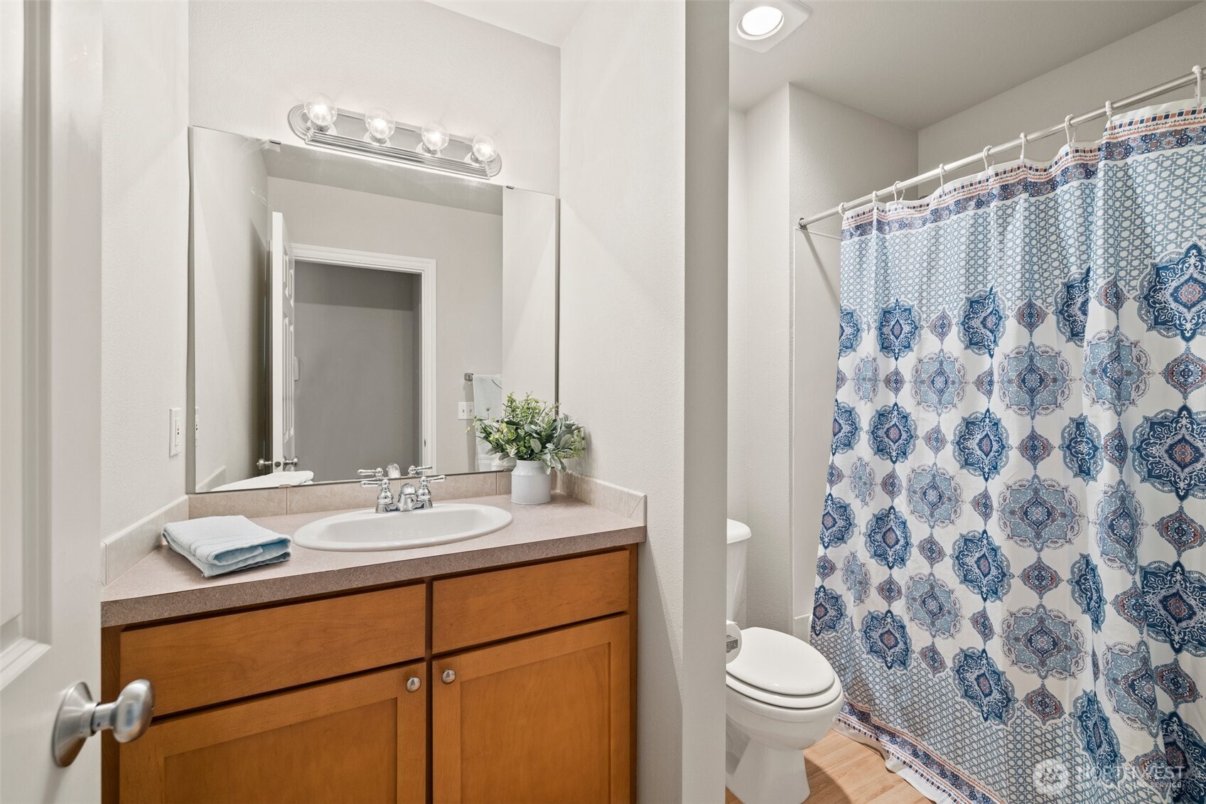 17432 Bothell Way Northeast, Unit B302 Bothell, WA 98011 - Photo 24 of 38 a bathroom with a granite countertop sink toilet and shower