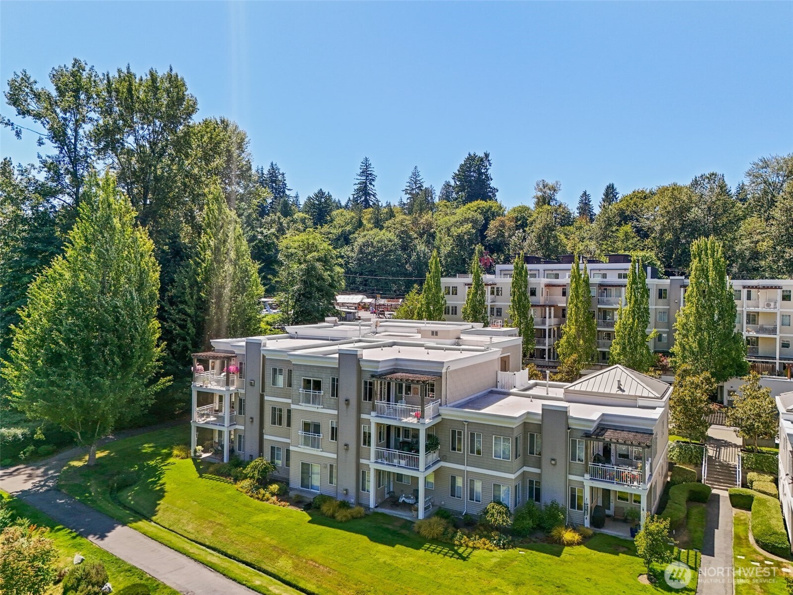 17432 Bothell Way Northeast, Unit B302 Bothell, WA 98011 - Photo 32 of 38 a view of a house with a swimming pool and sitting area