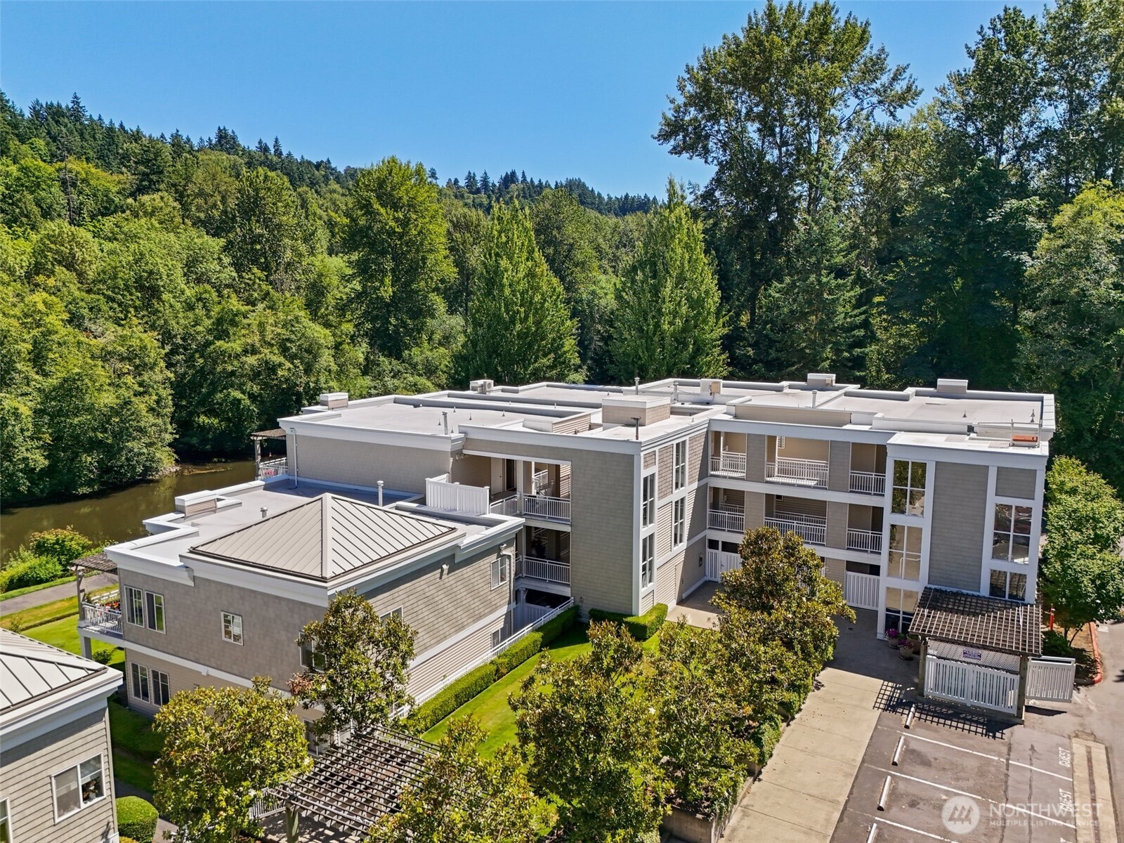 17432 Bothell Way Northeast, Unit B302 Bothell, WA 98011 - Photo 34 of 38 an aerial view of a house with a yard and lake view