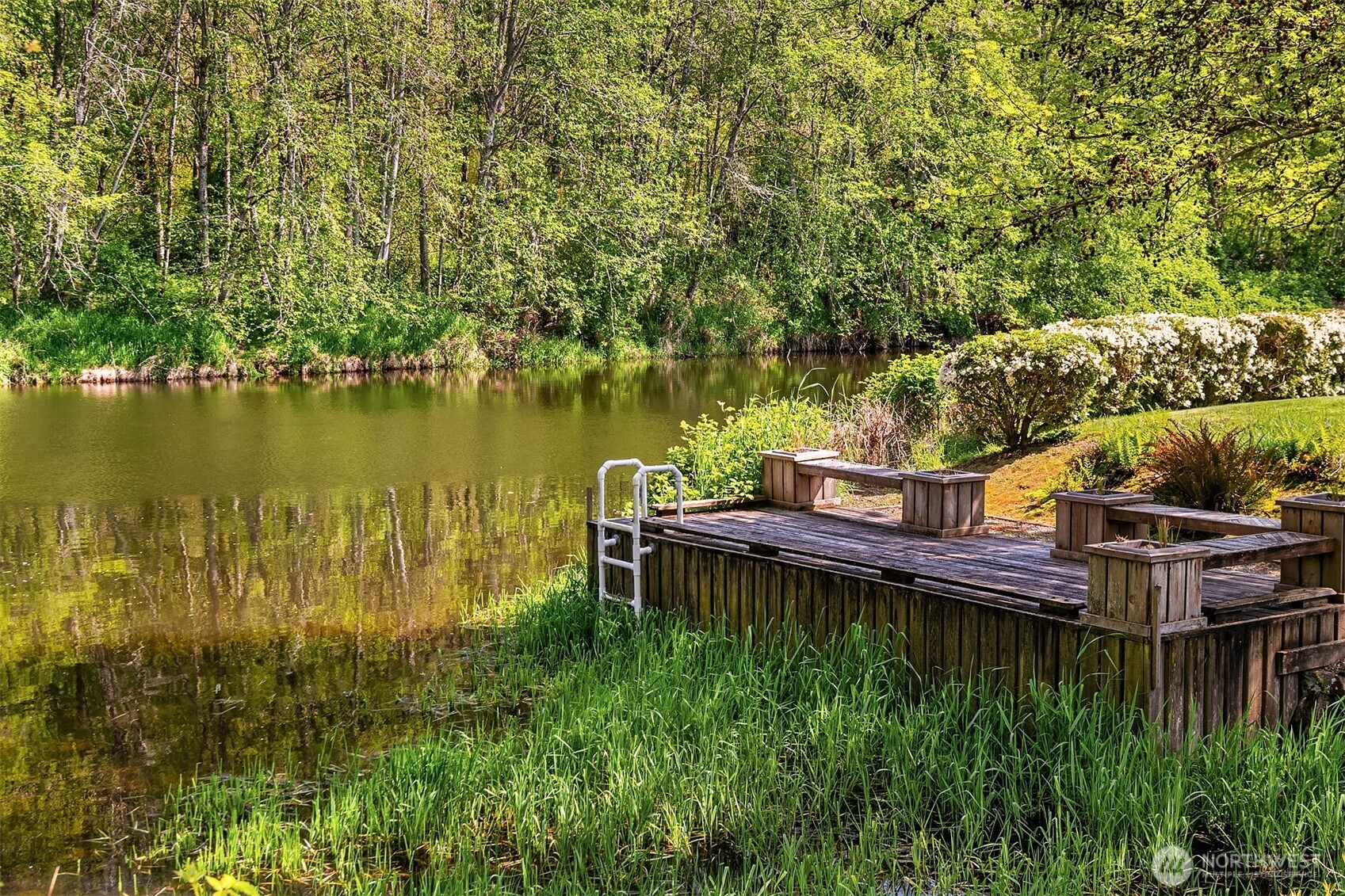 17432 Bothell Way Northeast, Unit B302 Bothell, WA 98011 - Photo 38 of 38 a view of a lake with a house in the background