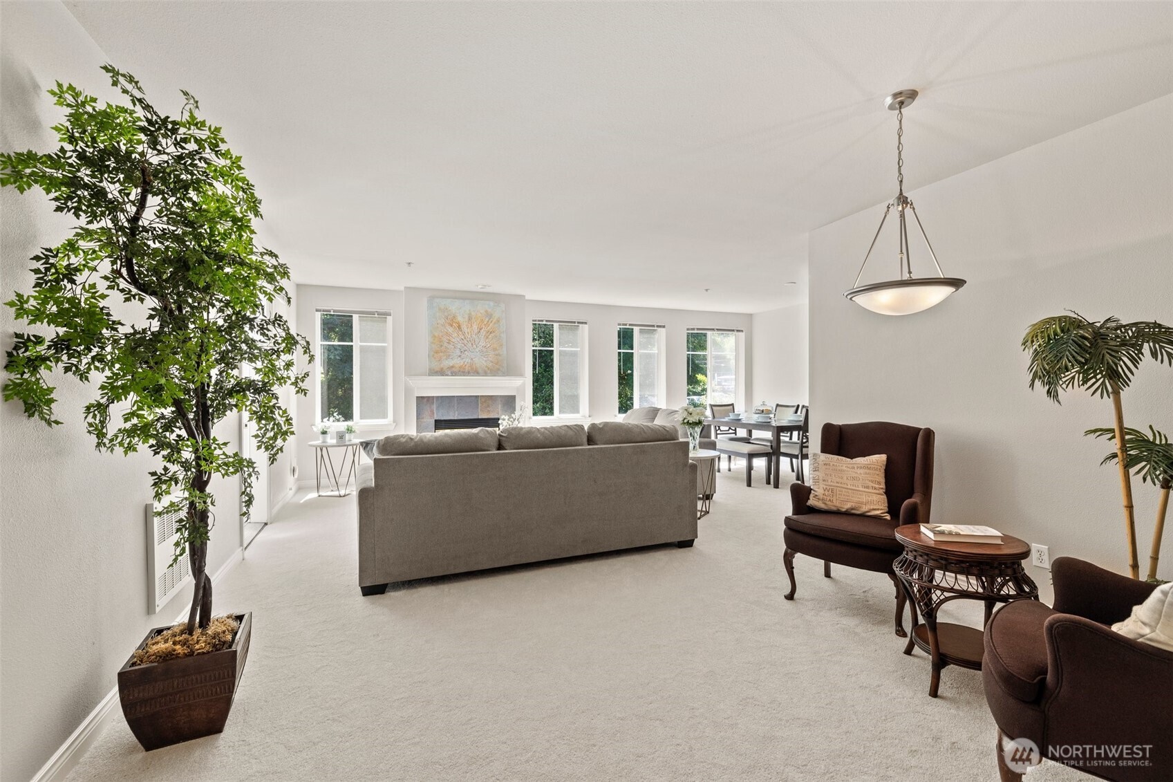 17432 Bothell Way Northeast, Unit B302 Bothell, WA 98011 - Photo 5 of 38 a living room with furniture and a potted plant