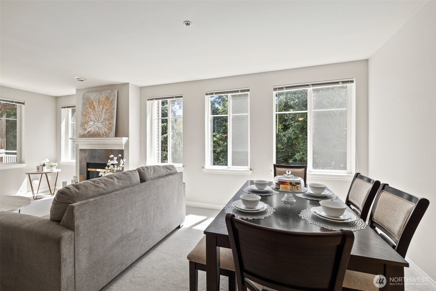 17432 Bothell Way Northeast, Unit B302 Bothell, WA 98011 - Photo 9 of 38 a living room with fireplace furniture and a large window