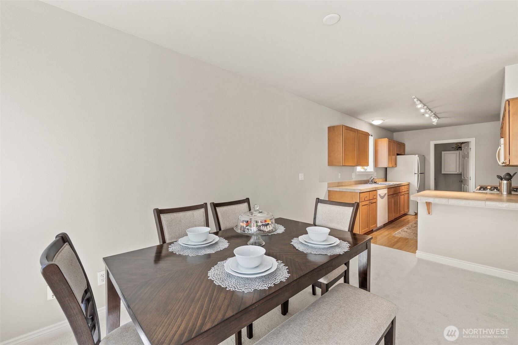 17432 Bothell Way Northeast, Unit B302 Bothell, WA 98011 - Photo 10 of 38 a view of a dining room with furniture and wooden floor