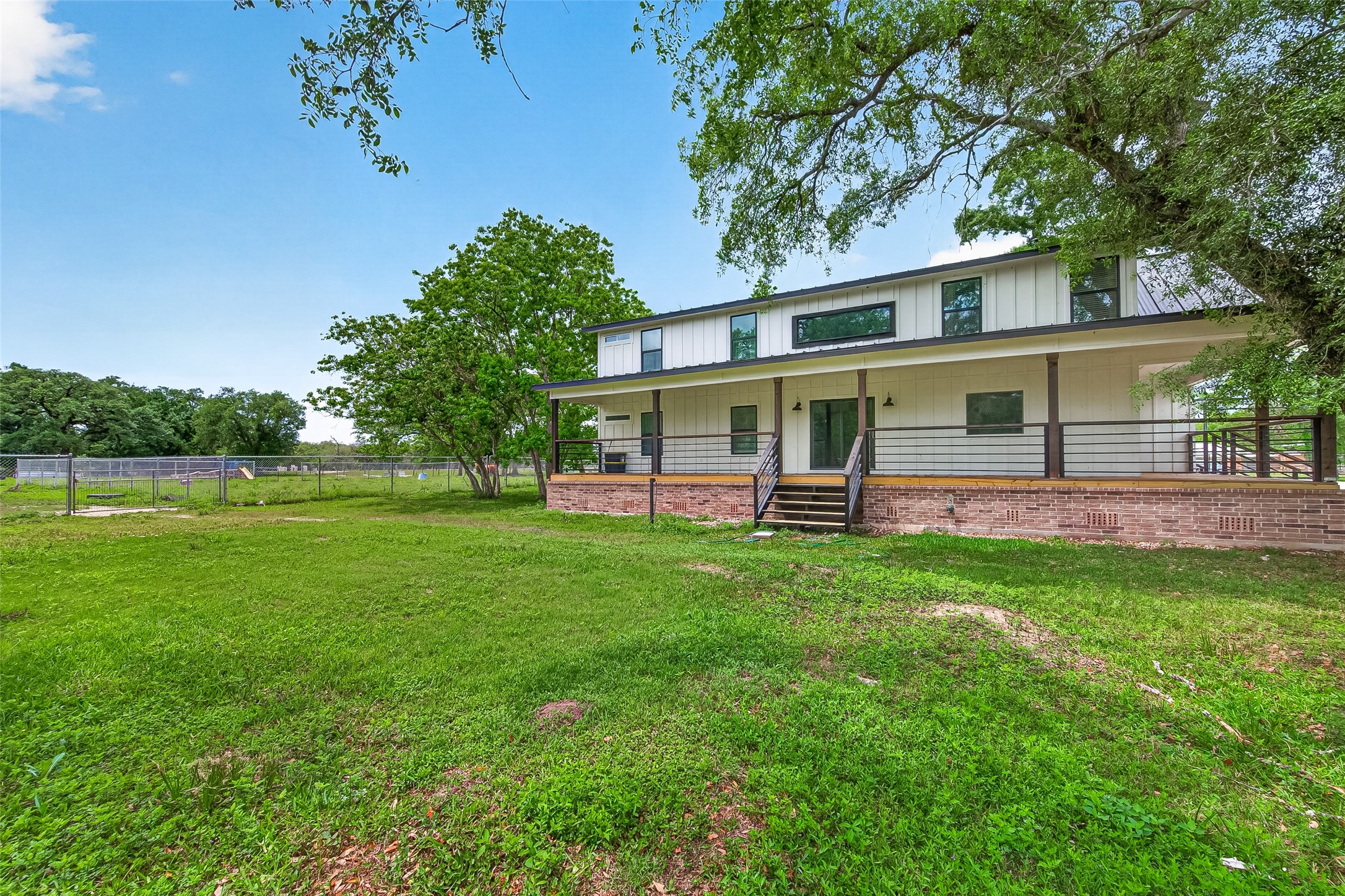 803 County Road 772 Damon, TX 77430 - Photo 38 of 50 a view of a house with a backyard