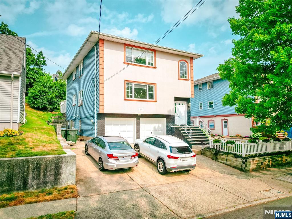 104 Eastern Way Rutherford, NJ 07070 - Photo 3 of 16 a car parked in front of a house