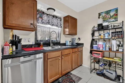 a kitchen with stainless steel appliances granite countertop a sink and cabinets
