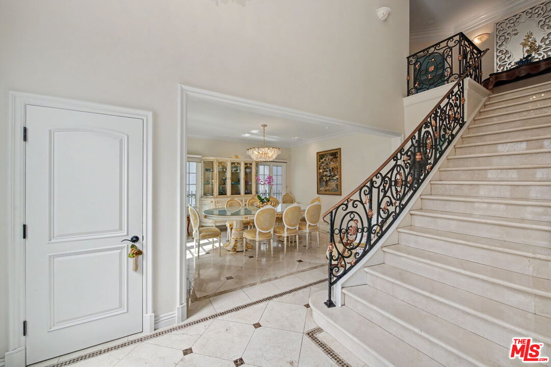 204 Foothill Road Beverly Hills, CA 90210 - Photo 4 of 38 a view of entryway and hall with wooden floor