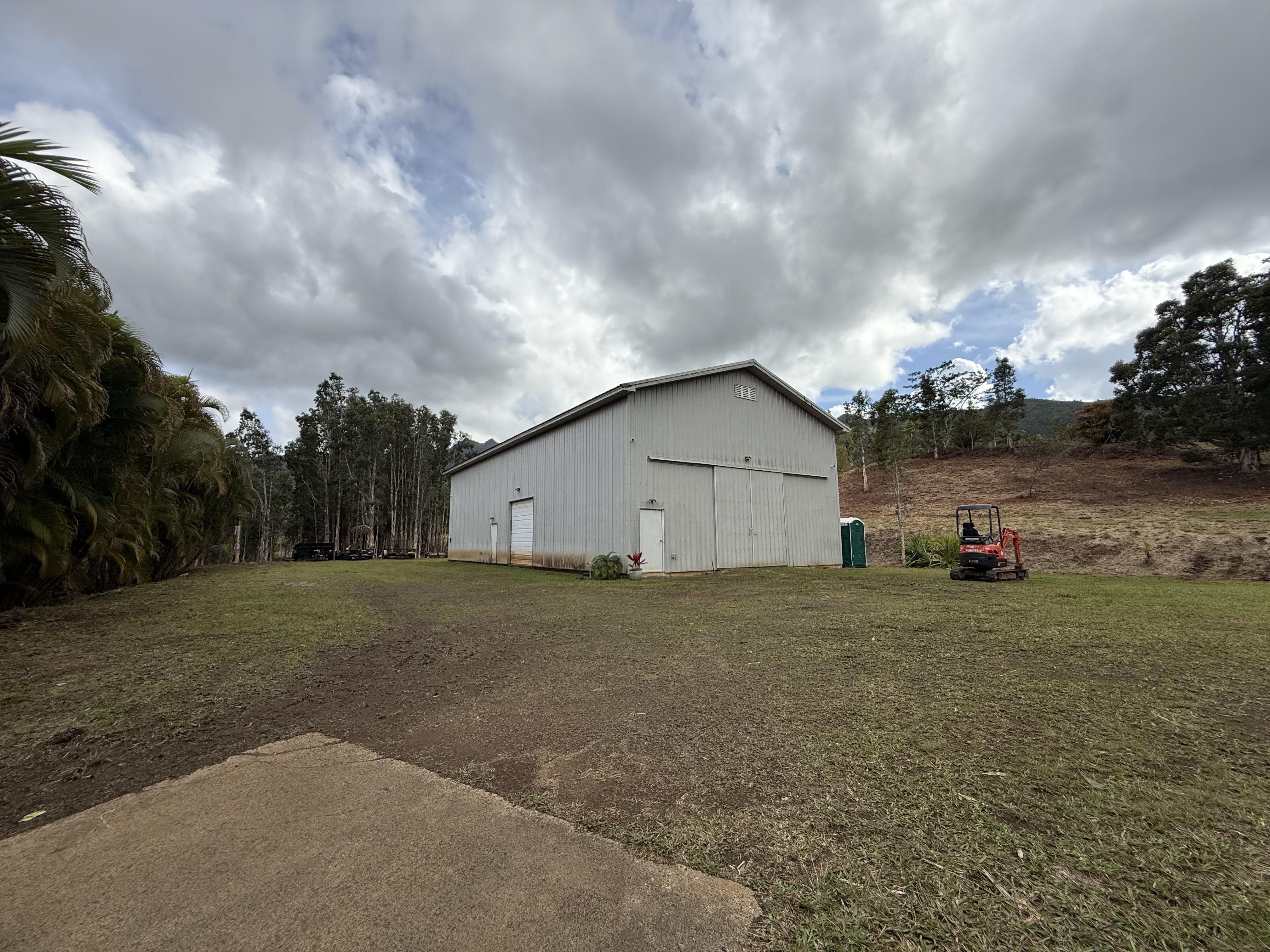 2818 Kamookoa Road, Unit 5 Kilauea, HI 96754 - Photo 28 of 29 a view of backyard of house and car parked