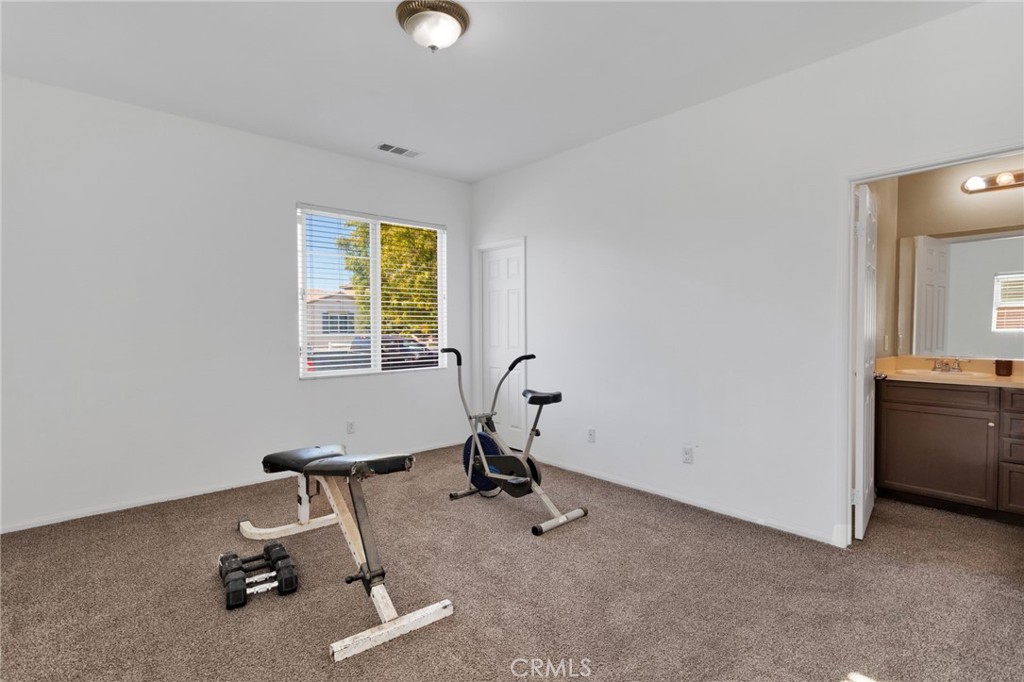 14245 Purple Canyon Road Adelanto, CA 92301 - Photo 16 of 38 a view of a room with gym equipment