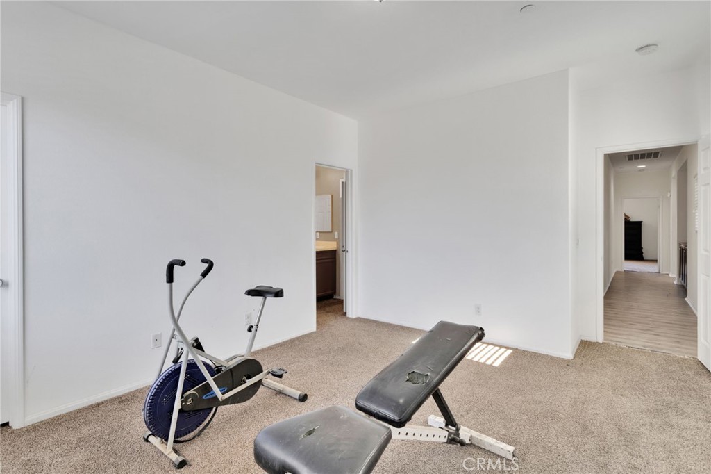 14245 Purple Canyon Road Adelanto, CA 92301 - Photo 17 of 38 a view of a workspace with furniture