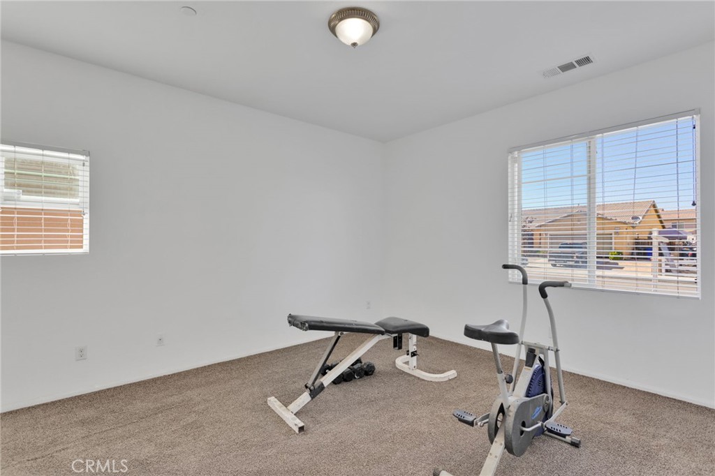 14245 Purple Canyon Road Adelanto, CA 92301 - Photo 18 of 38 a view of a workspace with a window