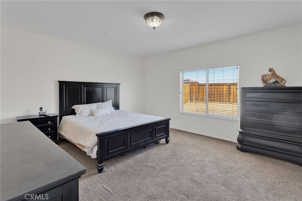 14245 Purple Canyon Road Adelanto, CA 92301 - Photo 25 of 38 a room with a bed and window