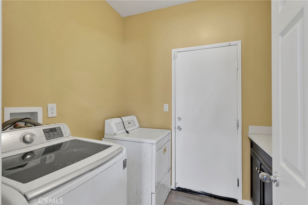 14245 Purple Canyon Road Adelanto, CA 92301 - Photo 33 of 38 a utility room with dryer and washer