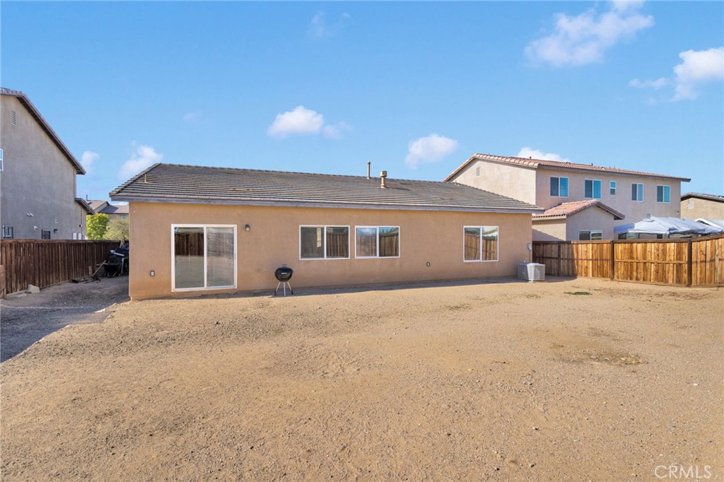 14245 Purple Canyon Road Adelanto, CA 92301 - Photo 36 of 38 a front view of a house with a yard