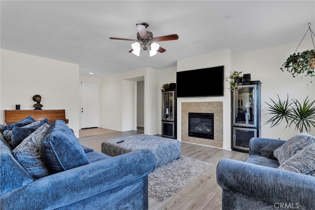 14245 Purple Canyon Road Adelanto, CA 92301 - Photo 10 of 38 a living room with furniture and a fireplace