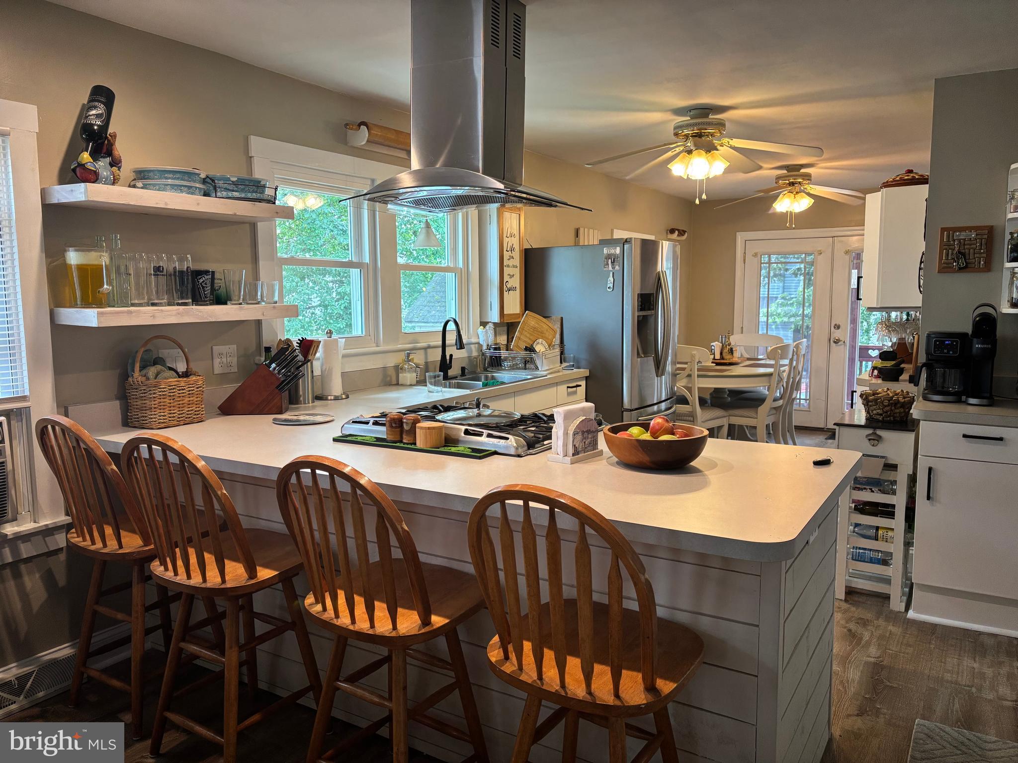 416 Wesley Avenue Pitman, NJ 08071 - Photo 11 of 47 a view of a dining room with furniture and a chandelier