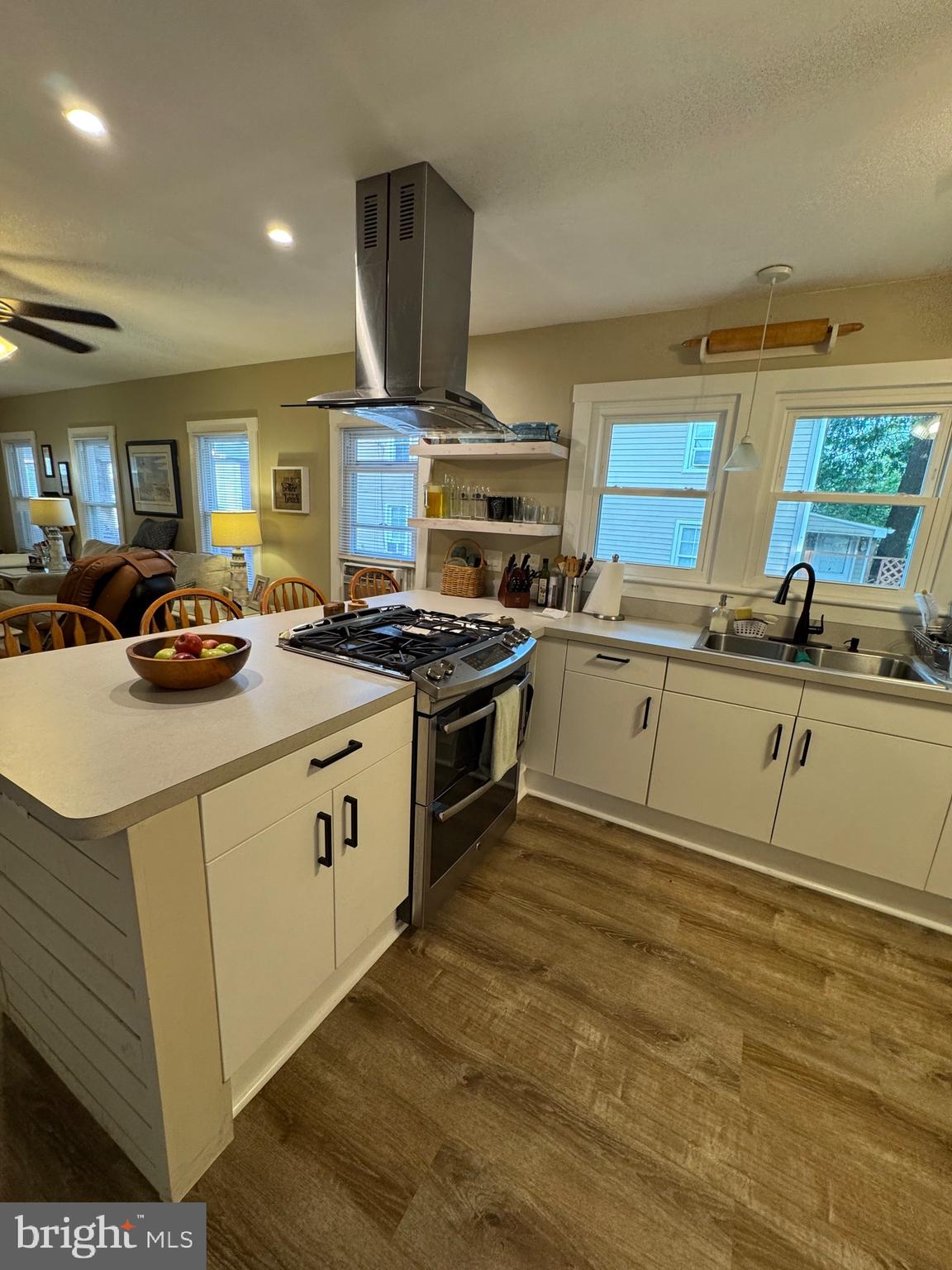 416 Wesley Avenue Pitman, NJ 08071 - Photo 16 of 47 a kitchen with a stove a sink and a refrigerator