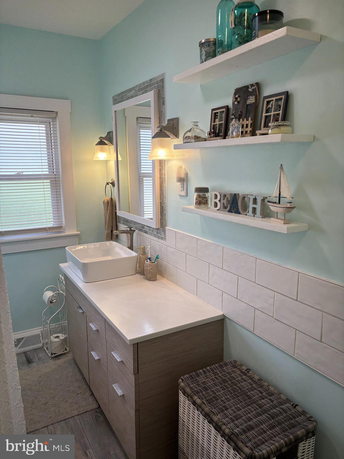 416 Wesley Avenue Pitman, NJ 08071 - Photo 43 of 47 a bathroom with a sink and a mirror